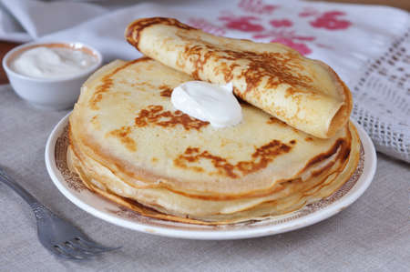 Pancakes with sour cream close up.の写真素材