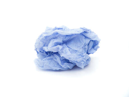 Crumpled paper close-up isolated on whiteの写真素材