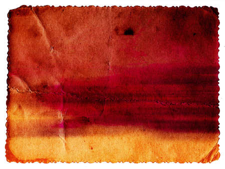 Pastel colored vintage textured card with carved edge isolated on whiteの写真素材