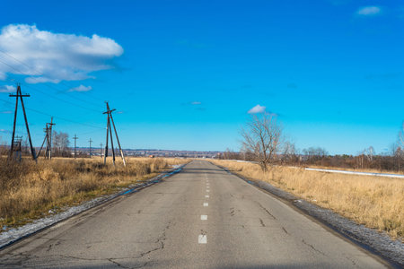 Autumn landscape with power lines on electric tower