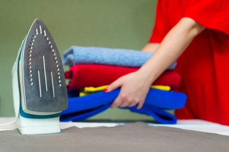 Iron on the background of womanの写真素材