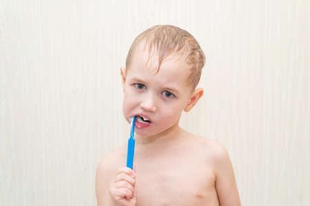 White caucasian boy in shaving foamの写真素材