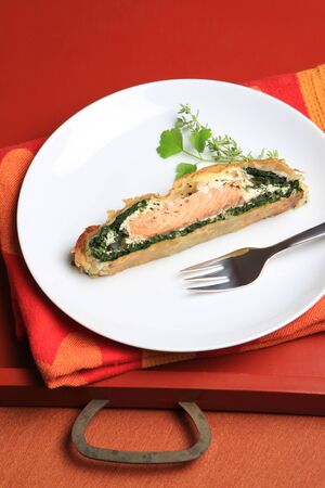 Salmon pie with spinach and sour cream in puff pastryの写真素材