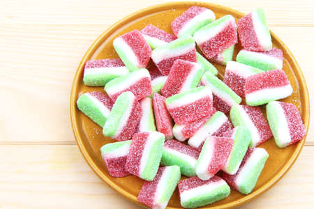 Colored gummy candies on plate on tableの写真素材