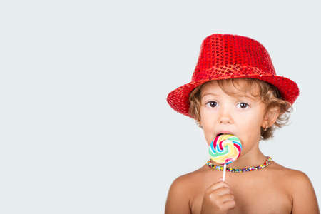 5 year old girl with lollipopsの写真素材