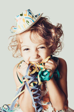 beautiful little girl with confettiの写真素材