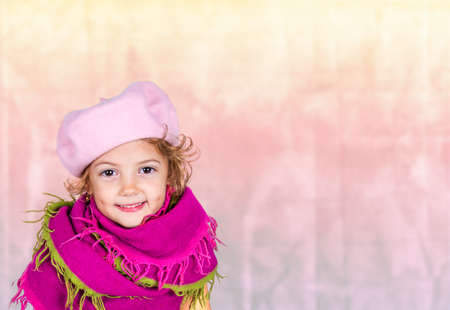 beautiful little girl with pink hatの写真素材