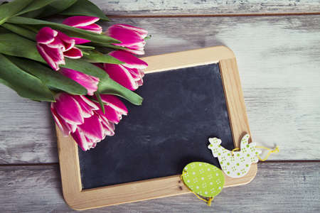 Blackboard with pink tulipsの写真素材