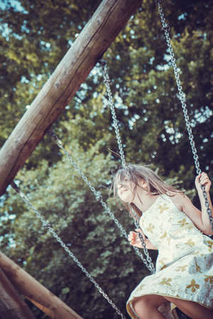 girl on the swingの写真素材