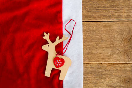 reindeer on Santa's hat on woodの写真素材