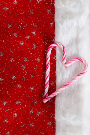 Santa's hat and candy canes heartの写真素材