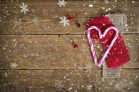 snowed background with hearts and berriesの写真素材