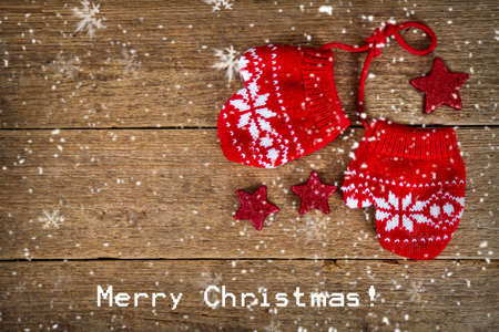 red gloves on wooden tableの写真素材