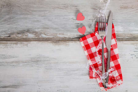 table setting with hearts on woodの写真素材