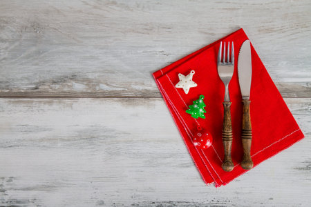Christmas And New Year Holiday Table Setting on the red napkinの写真素材