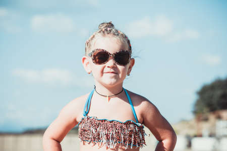 Beautiful little girl on the beachの写真素材