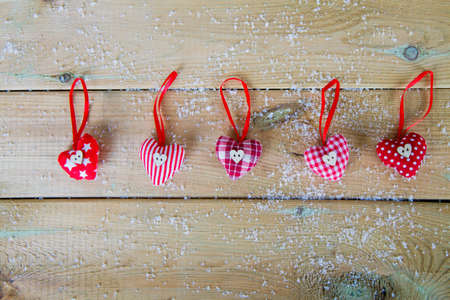 winter background with cloth heartsの写真素材