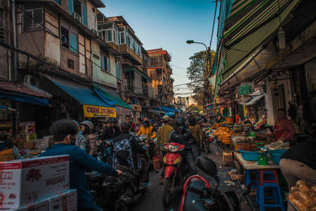 Hanoi, Vietnam - January 23, 2017 - A shot of people coming to buy and sell, in the busy streets of the old quarter.のeditorial素材