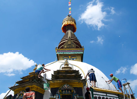 Kathmandu, Nepal-September 2013: Whitewashing A Stupa