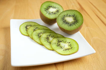 Kiwi fruit on a white plateの写真素材