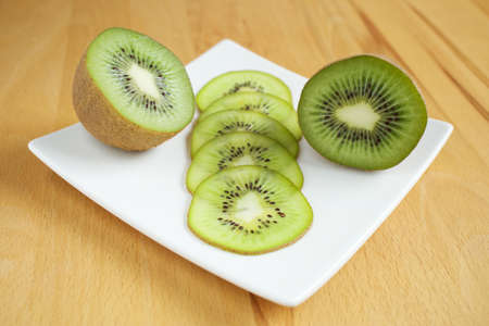 Kiwi fruit on a white plateの写真素材