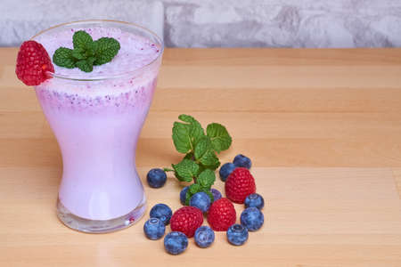 a smoothie with berriesの写真素材