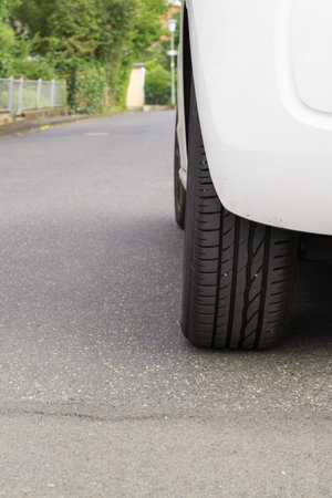 Close up of a car wheel on the ground
