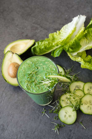 Green smoothie with a sliced ??cucumberの写真素材