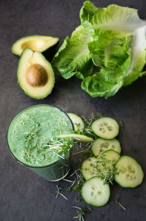 Green smoothie with a sliced ??cucumberの写真素材