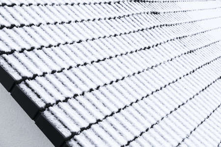 Snow-covered roofの写真素材