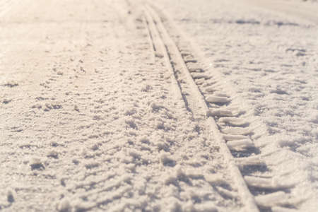 Tire tracks in the snowの写真素材