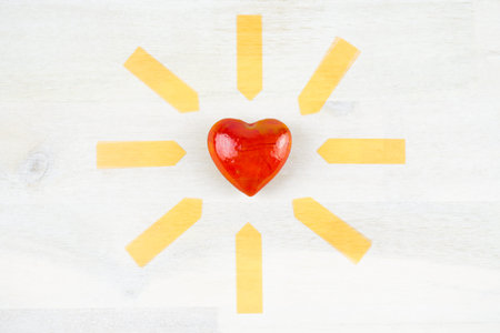 Red heart with yellow arrows around