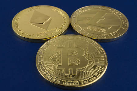 Bitcoin, ethereum and litecoin on blue backgroundの写真素材