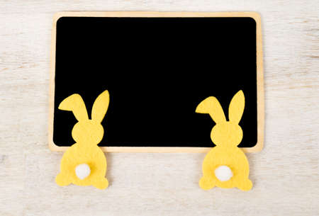 Two bunnies with black boardの写真素材