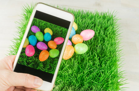 Taking a photo from colorful easter eggs with a smartphone