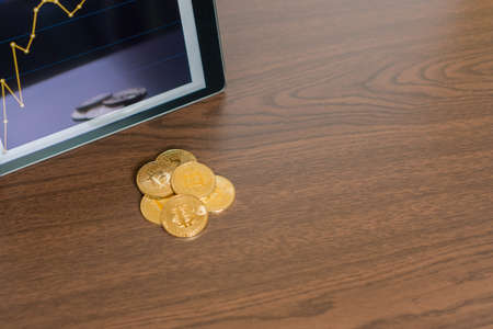 Tablet with golden bitcoinsの写真素材