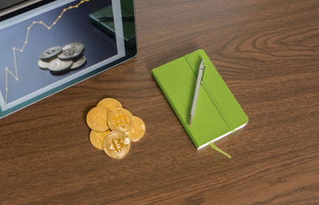 Tablet with golden bitcoinsの写真素材
