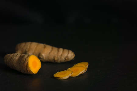Turmeric root on black backgroundの写真素材