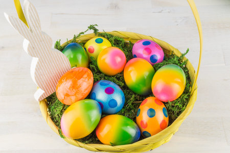Colorful easter eggs in basket