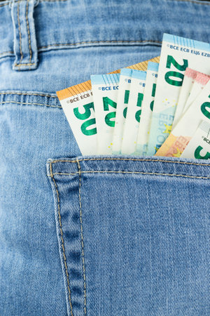 Banknotes in a jeans pocket