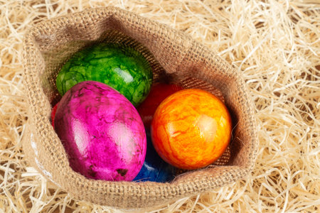 Colorful easter egg in straw