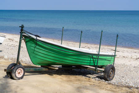 small colorful boats on the beach at the German Baltic coastの写真素材