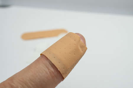 Finger with a plasterの写真素材