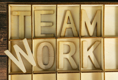 The word teamwork in wooden letters