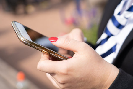 Woman is typing on her cellphone