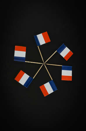 Many french flags in circle on black backgroundの写真素材