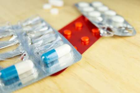Various tablets blisters on a wooden table