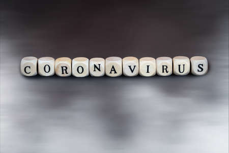 The word coronavirus in wooden cubesの写真素材