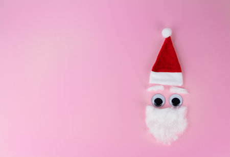 Funny santa claus head on pink background, copy spaceの写真素材