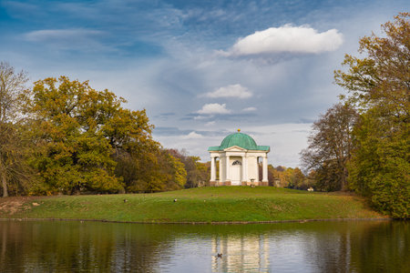 Small white temple in the Karlsaue in Kassel, Germany, on a sunny autumn dayの写真素材